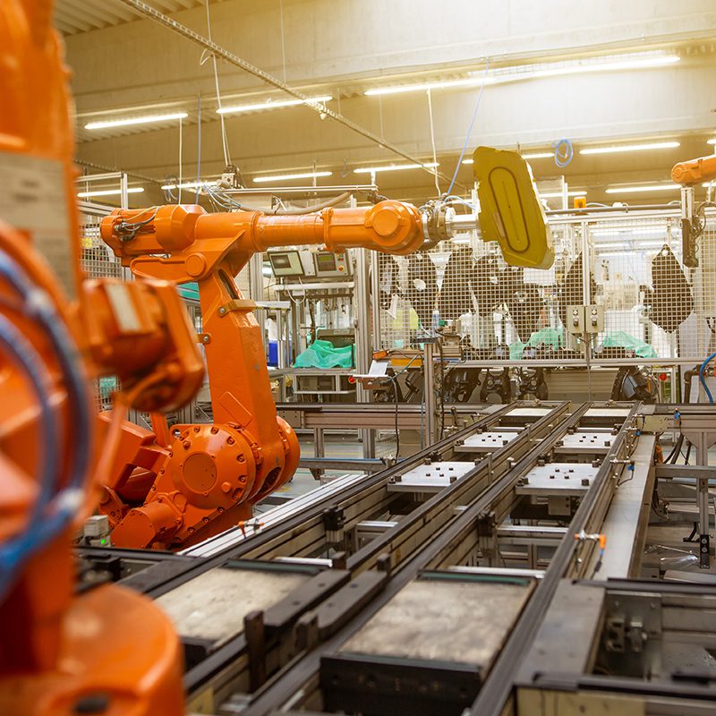 Automatic robots in an industrial factory