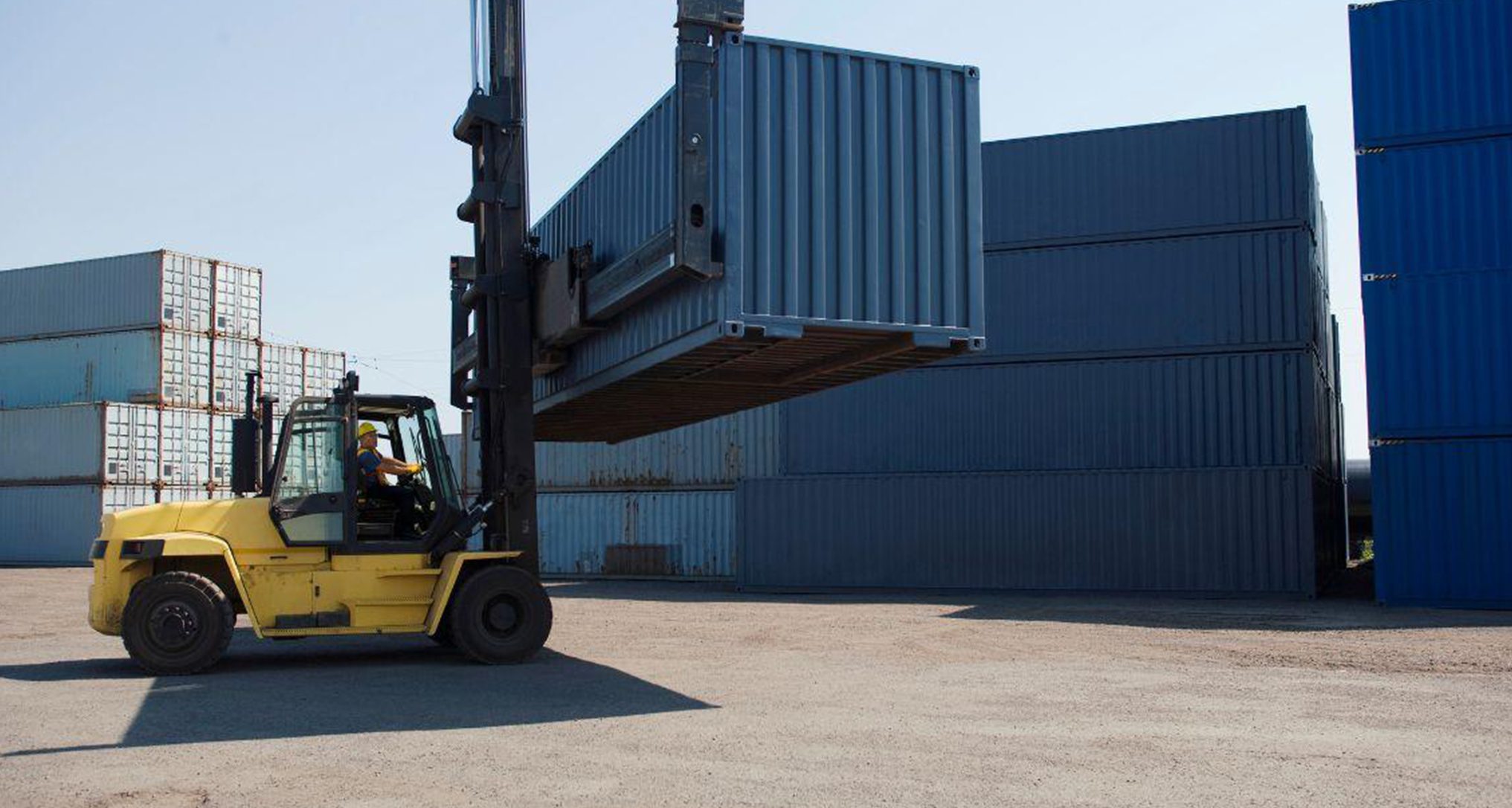 forklift moving shipping container