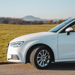 white car parked on the side of the road